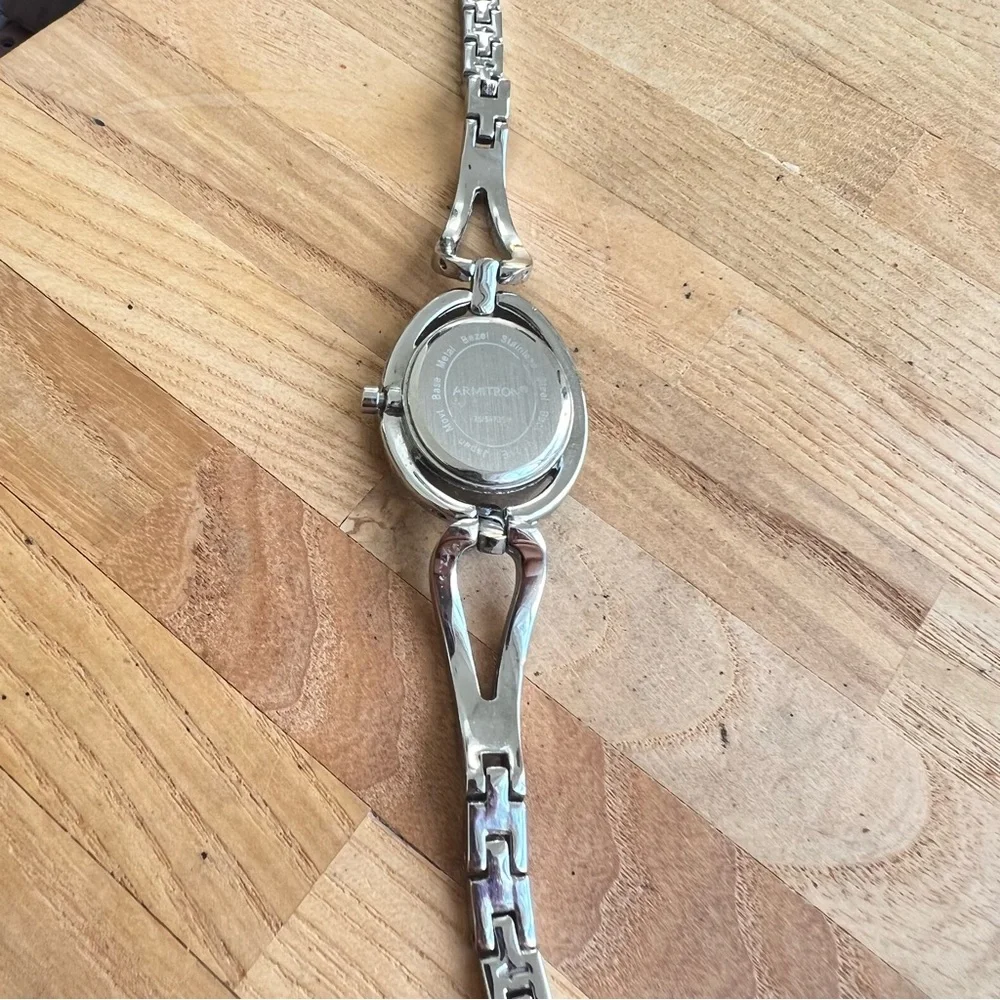 Armitron ladies oval black dial silver tone crystal bracelet watch NEW BATTERY